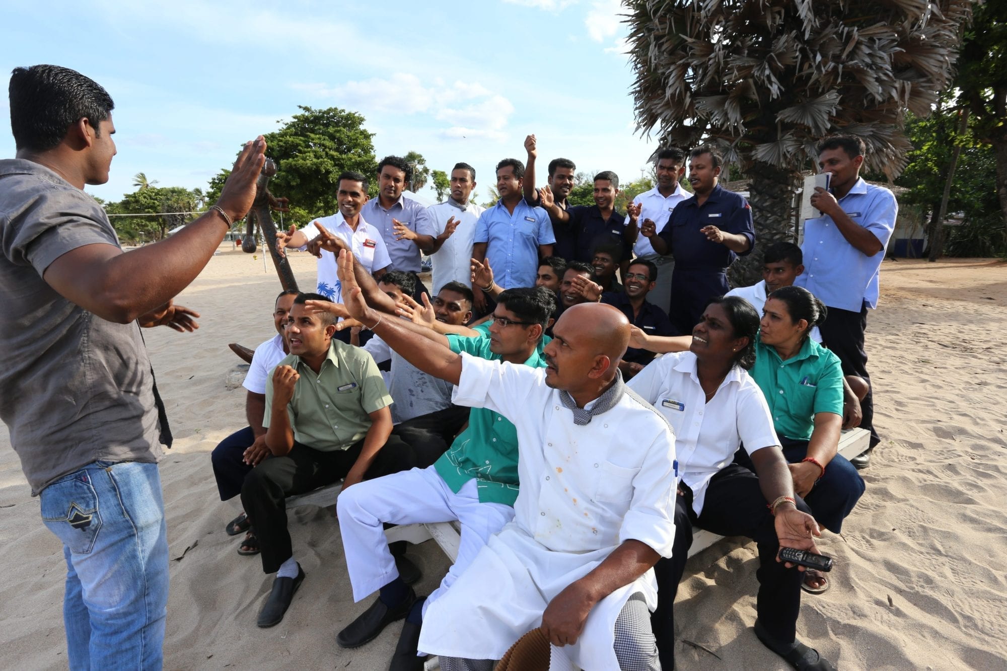 Sri Lanka hotel workers meet with a union shop steward on the beach