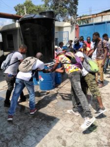 Haiti, workers washing hands outside garment factory, worker rights, unions, Solidarity Center