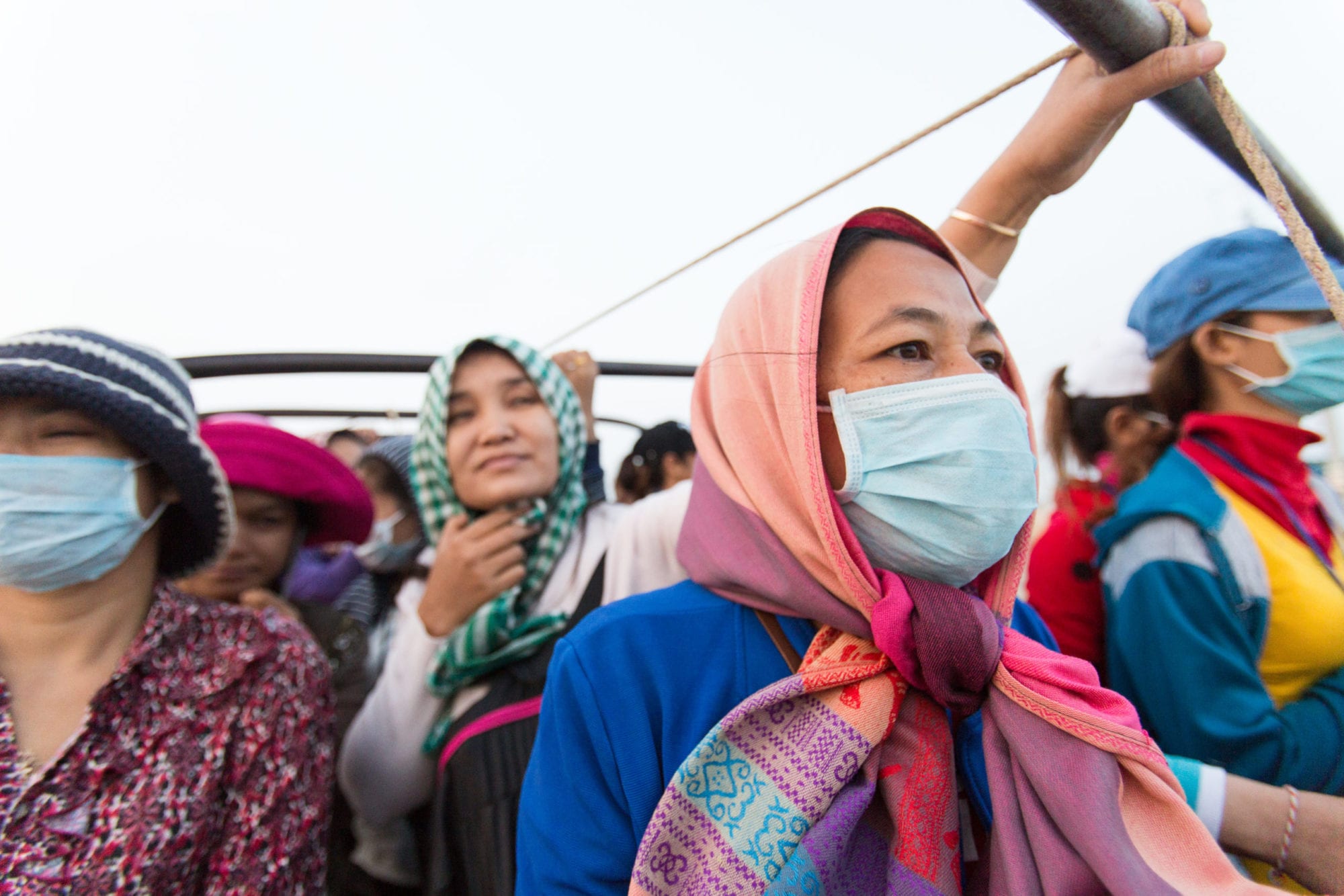 Cambodia, garment workers traveling in open truck to work, Solidarity Center, worker rights, human rights